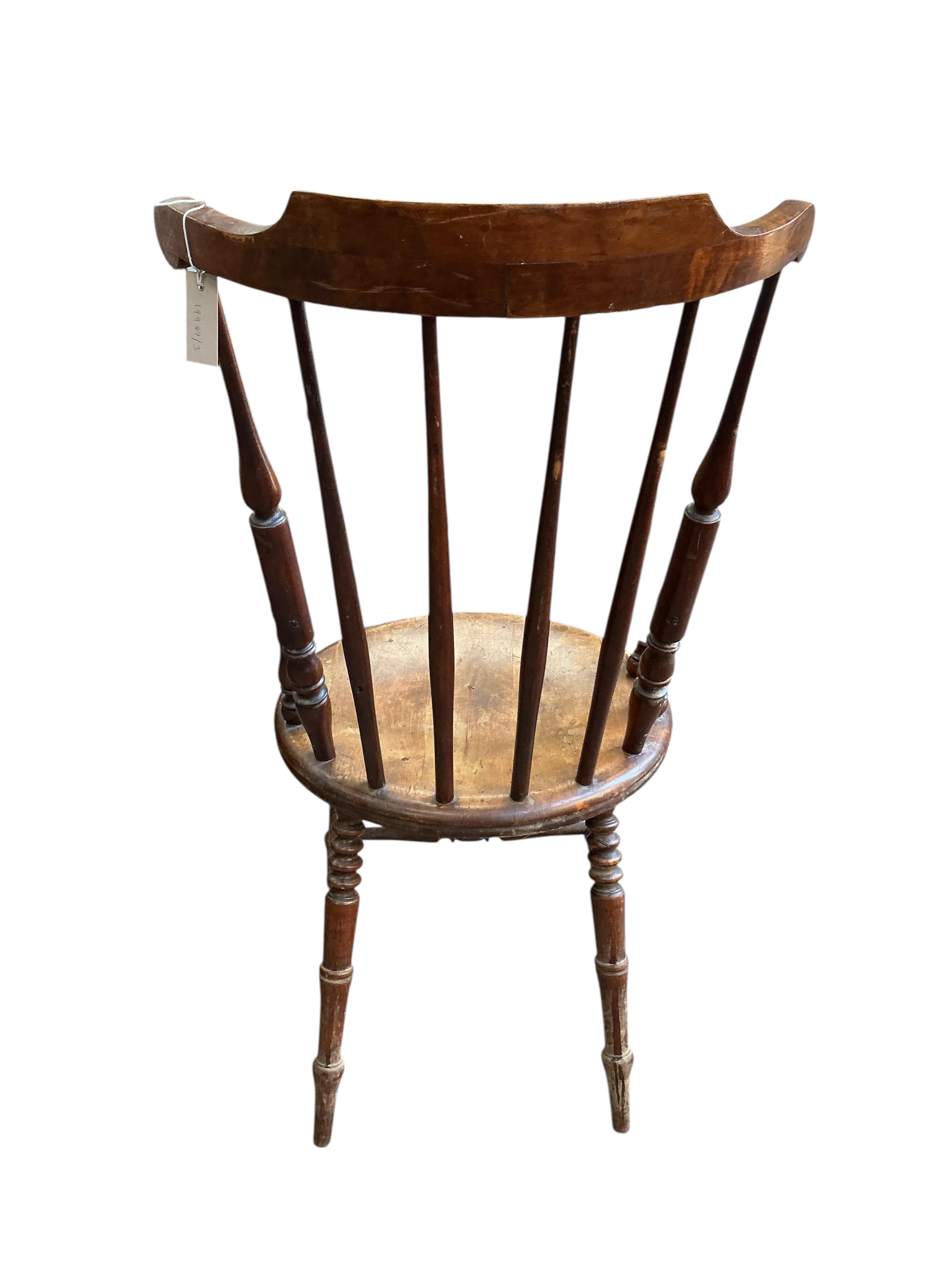 An early 20th century Windsor beech armchair, width 61cm, depth 52cm, height 110cm